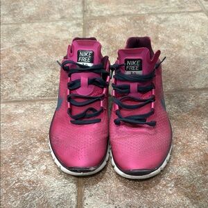 Nike Pink Sneakers with Black Accents and White Sole